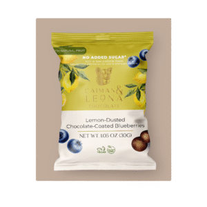 Blueberry dragees covered in chocolate and sprinkled with lemon